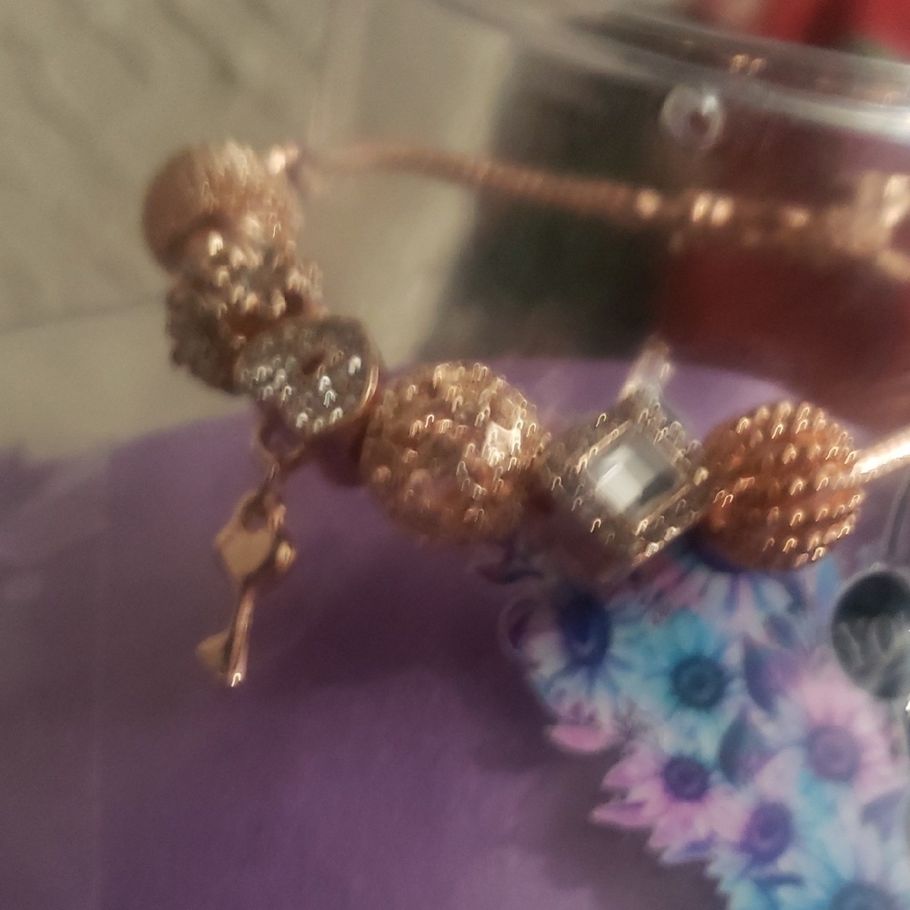 Elegant Gold and Silver Charm Bracelet